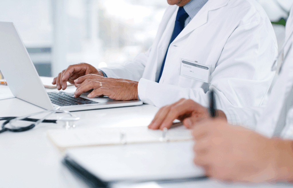 Healthcare administrators analyzing workflow data in SmarTrack Next OR Timeline View