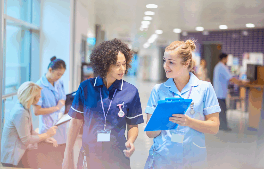 Operating room nurses coordinating procedures using SmarTrack Next OR Timeline View software